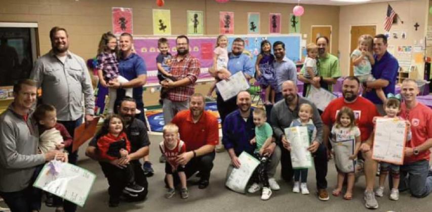 All Saints preschoolers welcome dads to class